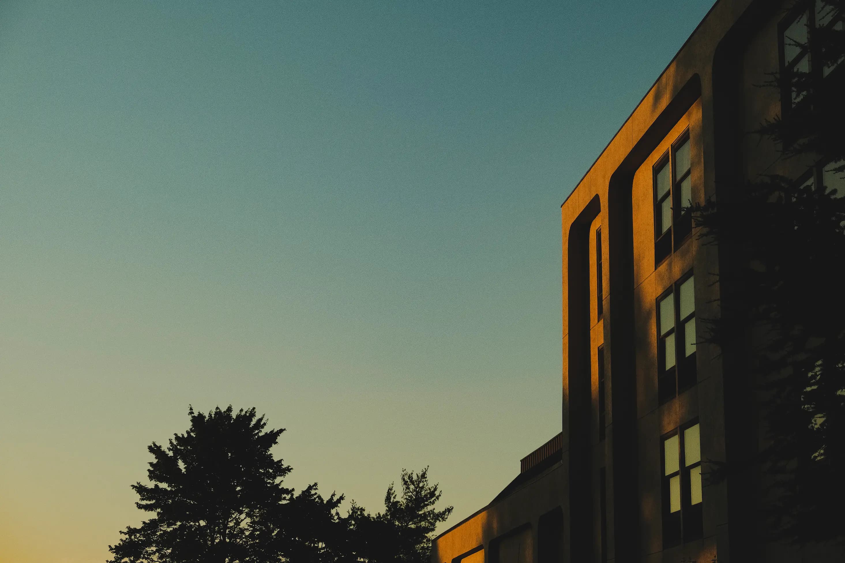 Building with sunset sky